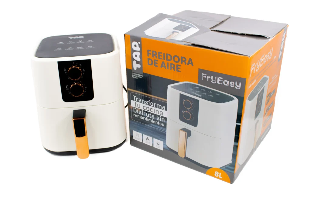 TAP white air fryer next to its packaging box